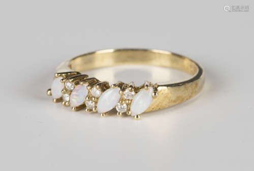 A 9ct gold, opal and diamond ring, mounted with four marquise shaped opals alternating with three