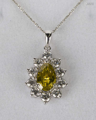 A platinum, colour enhanced dark fancy yellow diamond and diamond pendant, claw set with a pear