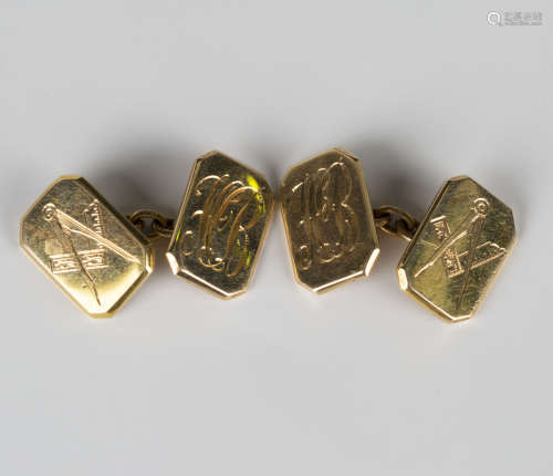 A pair of gold cut cornered rectangular cufflinks, one side engraved with Masonic square and