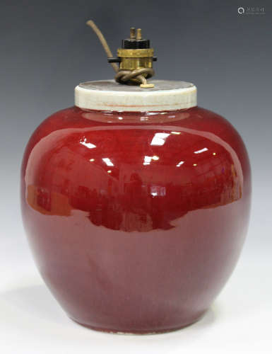 A Chinese sang-de-boeuf glazed porcelain ovoid jar, late Qing dynasty, with narrow upright clear
