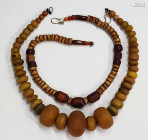 Two Tibetan bead necklaces, lengths 54cm and 50cm.Buyer’s Premium 29.4% (including VAT @ 20%) of the