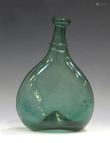 A Persian green glass saddle flask, 18th/19th century, of flattened form, the narrow neck with