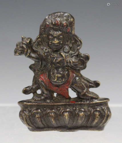 A Sino-Tibetan bronze diminutive figure of Mahakala, late Qing dynasty, cast standing on a lotus