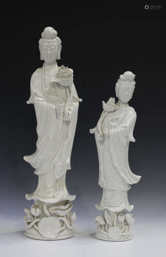 Two Chinese blanc-de-Chine figures of Guanyin, 20th century, each modelled standing and holding a
