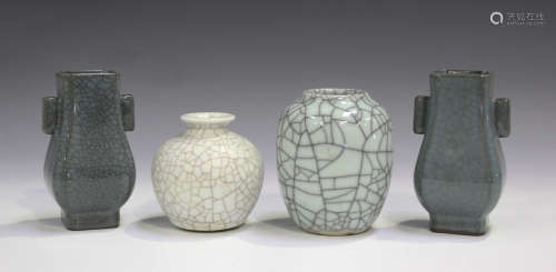 Two Chinese Guan-type crackle glazed hu vases, each pear shaped body with a pair of tubular
