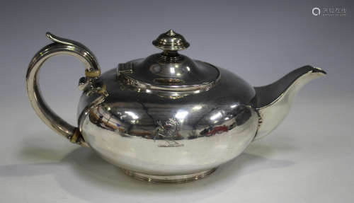 A William IV silver teapot of squat circular form, engraved with a horse crest, London 1831 by