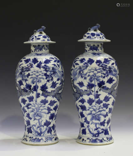 A pair of Chinese blue and white porcelain vases and covers, mark of Kangxi but late 19th century,
