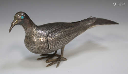A Persian silver model of a dove with engraved plumage and inset turquoise eyes, marked to tail,
