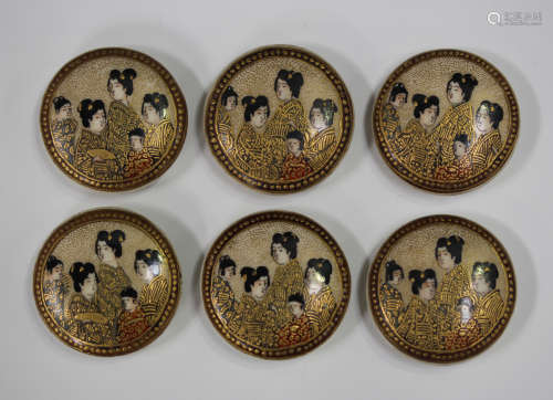 A set of six Japanese Satsuma earthenware circular buttons, Meiji period, each painted and gilt with