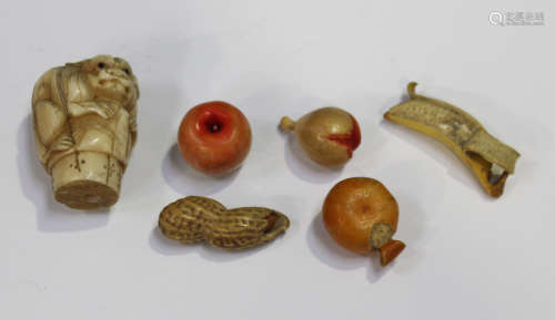 A group of five Chinese Canton carved and stained models of fruit and a nut, late Qing dynasty,