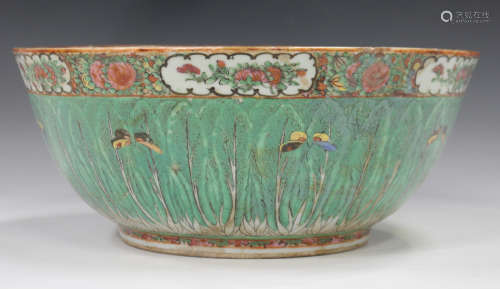 A Chinese Canton famille rose punch bowl, late 19th century, painted inside and out with overlapping