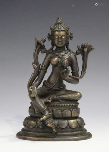 A Sino-Tibetan brown patinated bronze figure of Tara, probably 20th century, modelled seated in