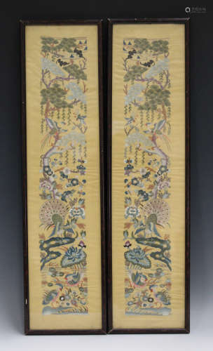 A pair of Chinese silk embroidered sleeve panels, 20th century, worked in coloured threads with