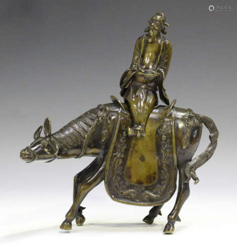 A Chinese brown patinated bronze incense burner, Qing dynasty, modelled as a detachable immortal