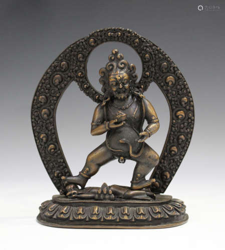 A Sino-Tibetan brown patinated sectional figure of Jambhala, 20th century or later, the god of