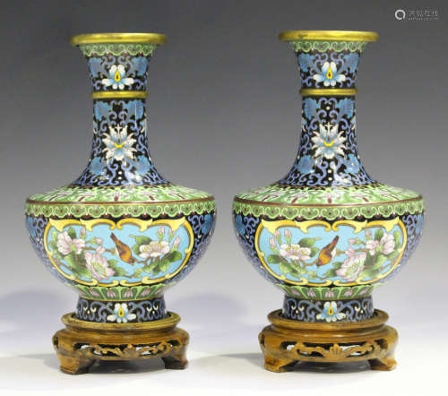 A pair of Chinese cloisonné vases, late 20th century, decorated with opposing panels of birds on