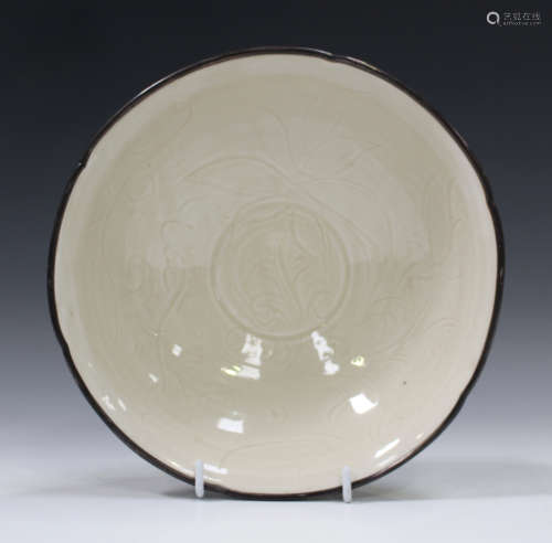 A Chinese Dingyao-type bowl, Song style but probably 20th century, the interior carved in low relief