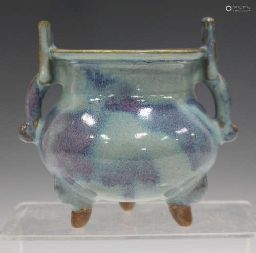 A Chinese Jun-type stoneware tripod censer, Song dynasty or later, of squat globular form with short