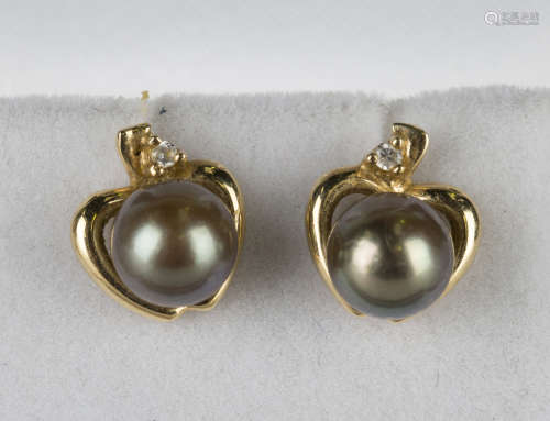A pair of 18ct gold, sapphire and diamond earstuds, each mounted with a pear shaped sapphire and two