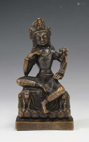 A Sino-Tibetan brown patinated bronze figure of a bodhisattva, modelled seated on a Buddhistic