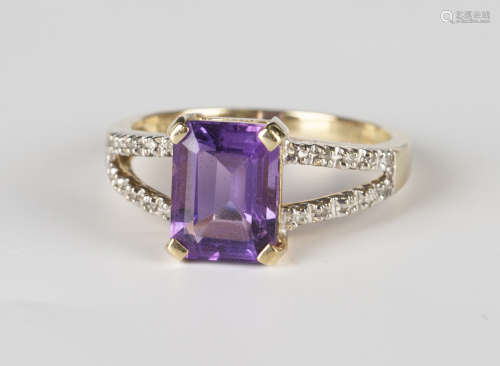 A 9ct gold, amethyst and diamond ring, claw set with a cut cornered rectangular step cut amethyst