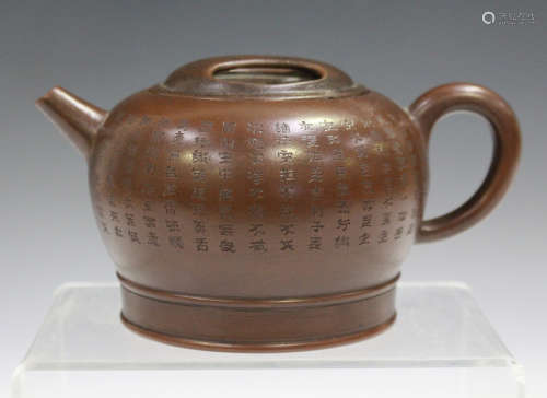 A Chinese Yixing stoneware teapot and cover, probably 20th century, the compressed circular body