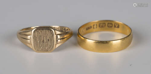 A 22ct gold wedding band ring, Birmingham 1920, ring size approx P, and a 9ct gold signet ring,