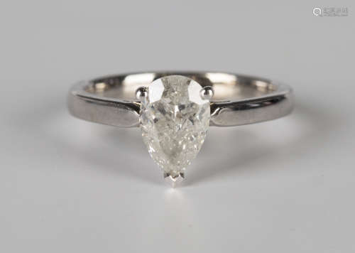 An 18ct white gold and diamond single stone ring, claw set with a pear shaped diamond, ring size
