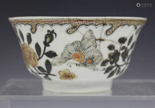 A Chinese porcelain bowl, Yongzheng period, painted en grisaille with butterflies and insects amidst