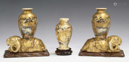 A pair of Japanese Satsuma earthenware vases, Meiji period, each elongated ovoid body painted and