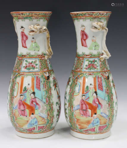 A pair of Chinese Canton famille rose porcelain vases, mid to late 19th century, each typically