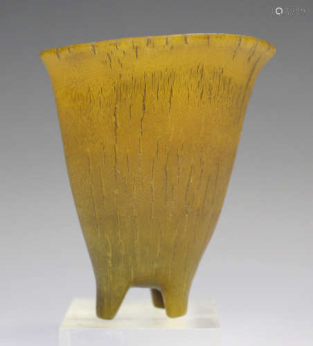 A rhinoceros horn libation cup, early Qing dynasty, of tapering form with slightly flared rim,