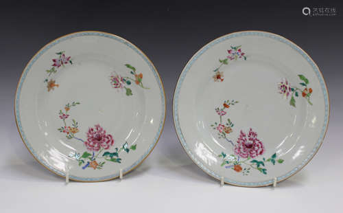 A pair of Chinese famille rose export porcelain plates, Yongzheng/Qianlong period, each painted with