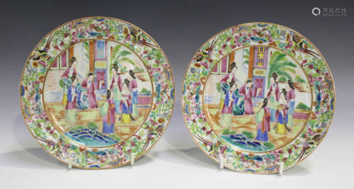 A pair of Chinese Canton famille rose porcelain plates, mid-19th century, each painted with a