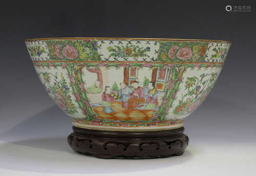 A Chinese Canton famille rose porcelain punch bowl, late 19th century, typically painted with panels