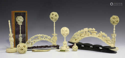 A group of five Chinese Canton export ivory concentric balls and stands, late 19th/early 20th