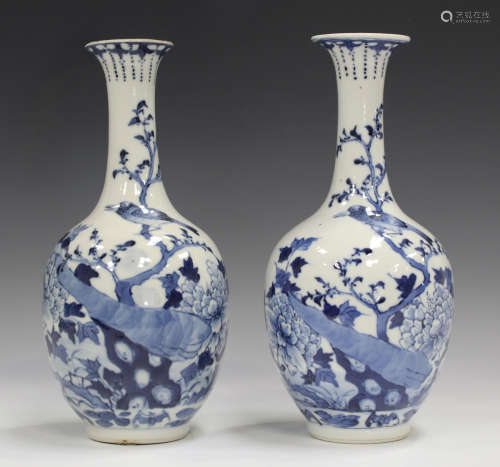 A pair of Chinese blue and white porcelain bottle vases, late 19th century, each ovoid body and