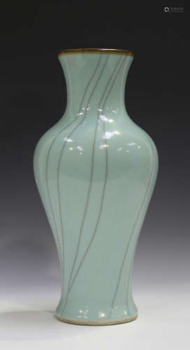 A Chinese pale blue glazed vase of baluster form with iron oxide rim above grey vertical crackle