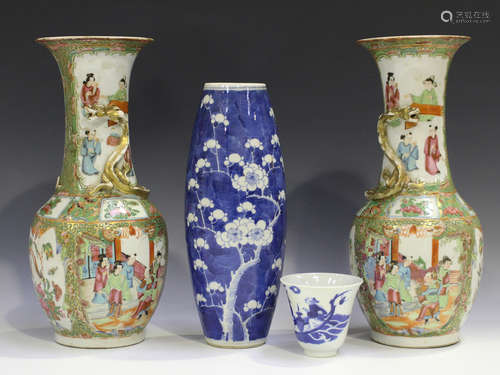 A pair of Chinese Canton famille rose porcelain vases, mid to late 19th century, each typically