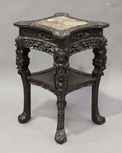 A Chinese hardwood two-tier stand, late Qing dynasty, the top inset with a rouge marble panel within