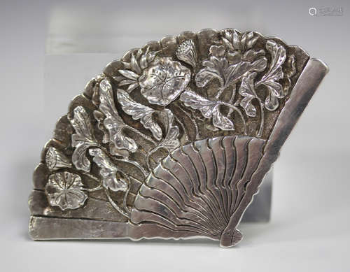 A Chinese silver brooch, early 20th century, in the form of a fan with lotus decoration, maker's