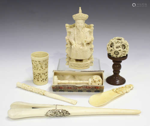 A small group of Chinese Canton ivory, mid-19th century or later, comprising a figure of a seated