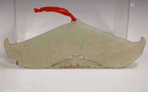 A Chinese pale celadon jade chime pendant (huang), late Qing dynasty/early 20th century, each side