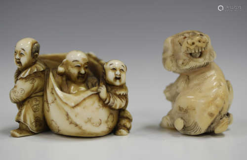 A Japanese carved and stained ivory netsuke, Meiji/Taisho period, modelled as Hotei seated in a bag,