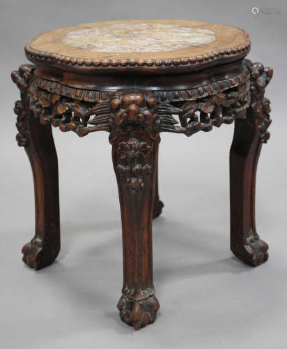 A Chinese hardwood stand, early 20th century, the top inset with a rouge marble panel within a