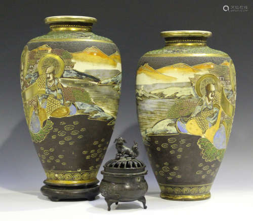 A pair of Japanese Satsuma earthenware vases, 20th century, each painted and gilt with arhats in