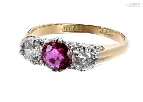 18ct ruby and diamond three stone ring, the central ruby 0.70ct approx, flanked with round