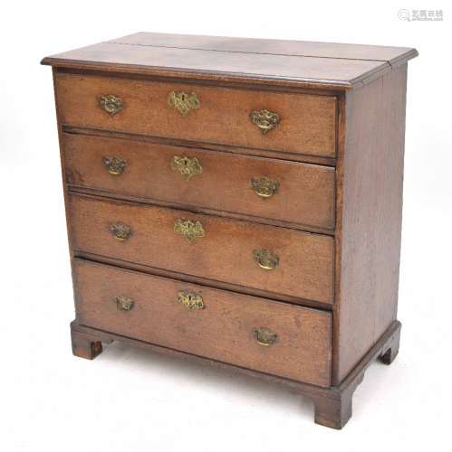 Georgian oak chest of drawers, the moulded top over four graduated drawers, with brass handles and