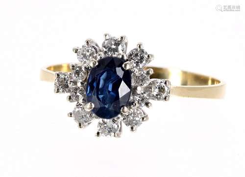 18ct sapphire and diamond cluster ring, the oval sapphire of a rich blue colour 0.90 ct approx, in a