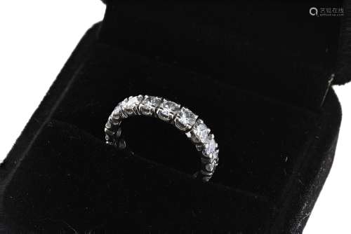 Good quality modern white gold diamond full eternity ring, with eighteen round brilliant-cuts,